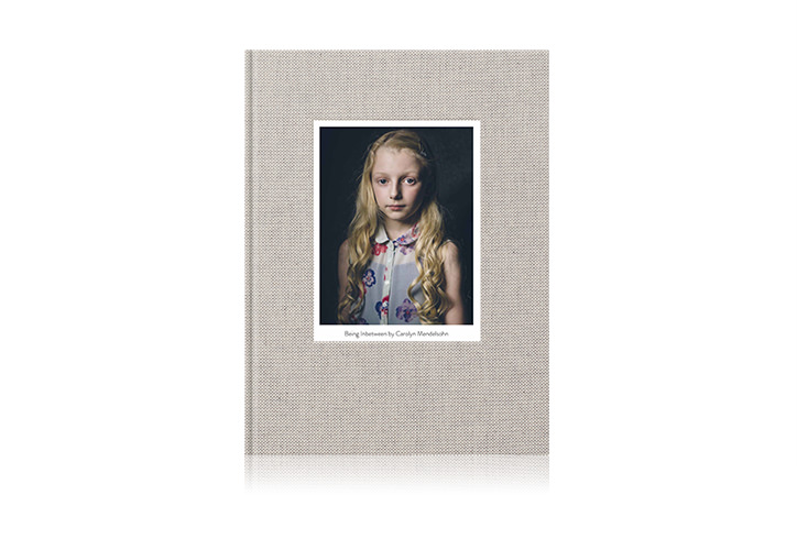 Portrait photo book with cover image of a young girl