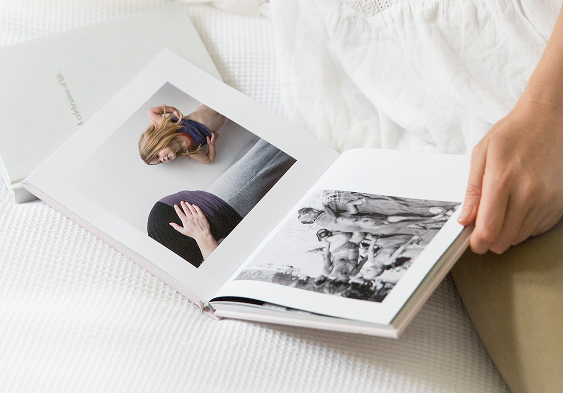 Closeup of person looking through pages of their photo book.