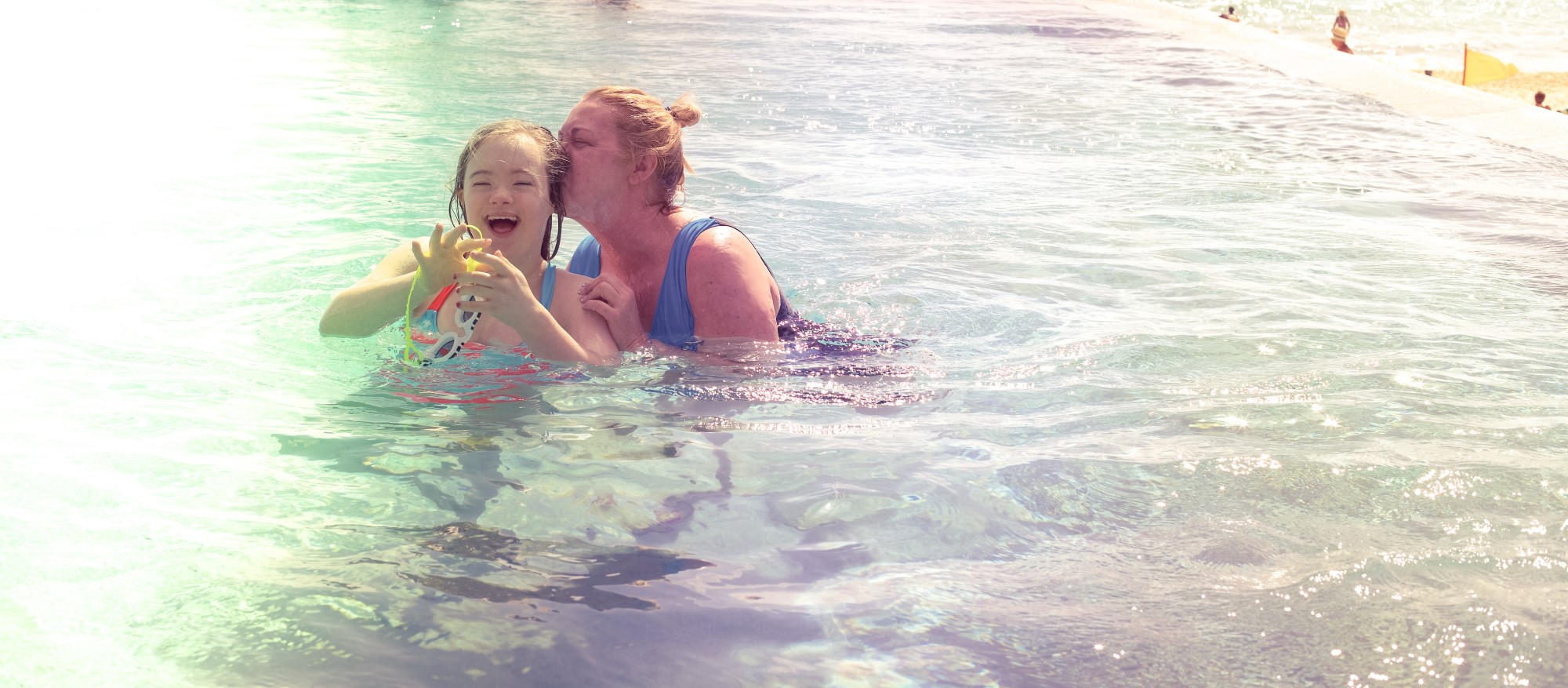Mother and daughter in the pool.