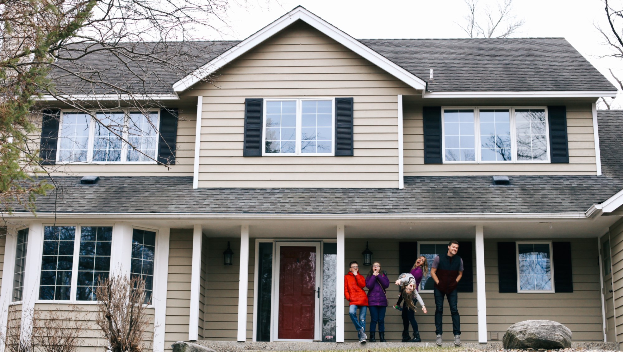 Family outside their home.