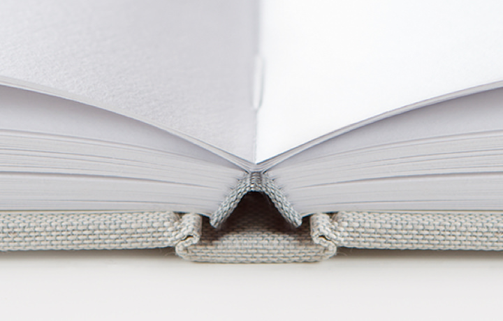 Closeup of premium photo book stitch binding