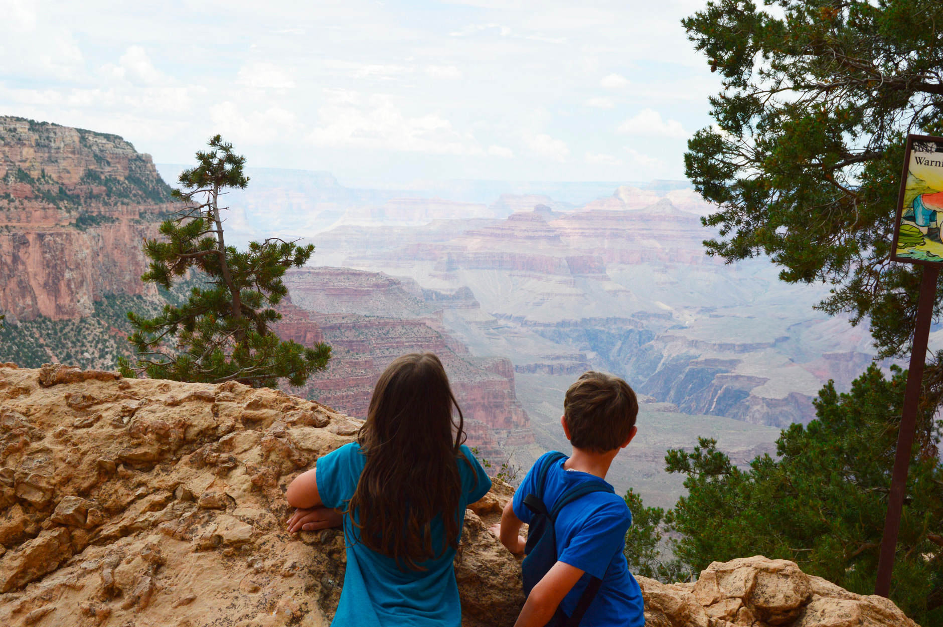 Kids overlooking a canyon.