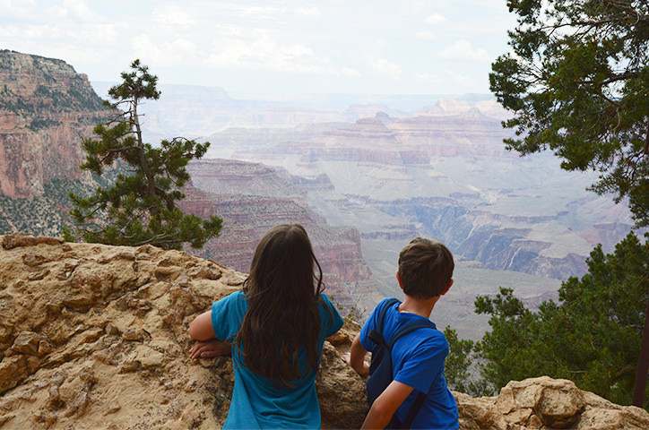 Two people overlooking a canyon.