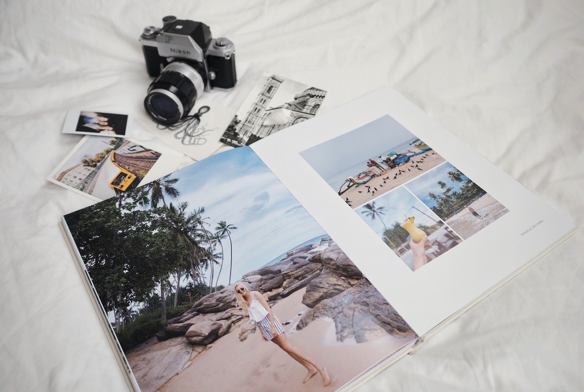Flatlay of photobook, camera and sketches
