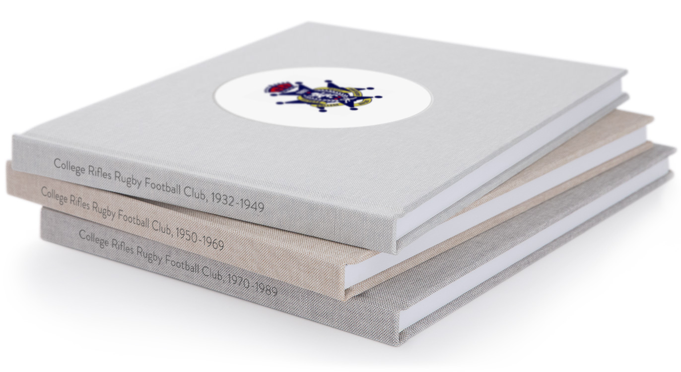 Three Premium Photo Books stacked atop each other