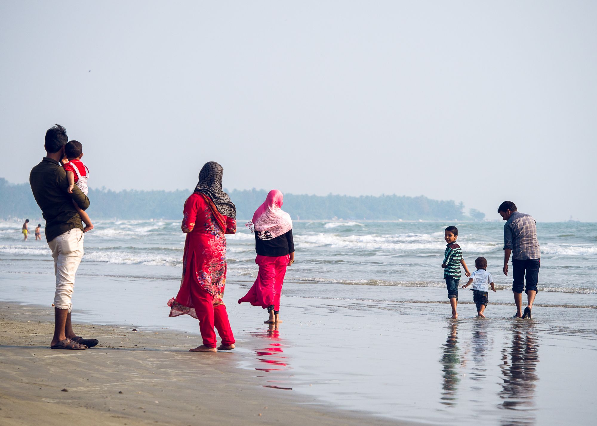 Family at the beach in India.