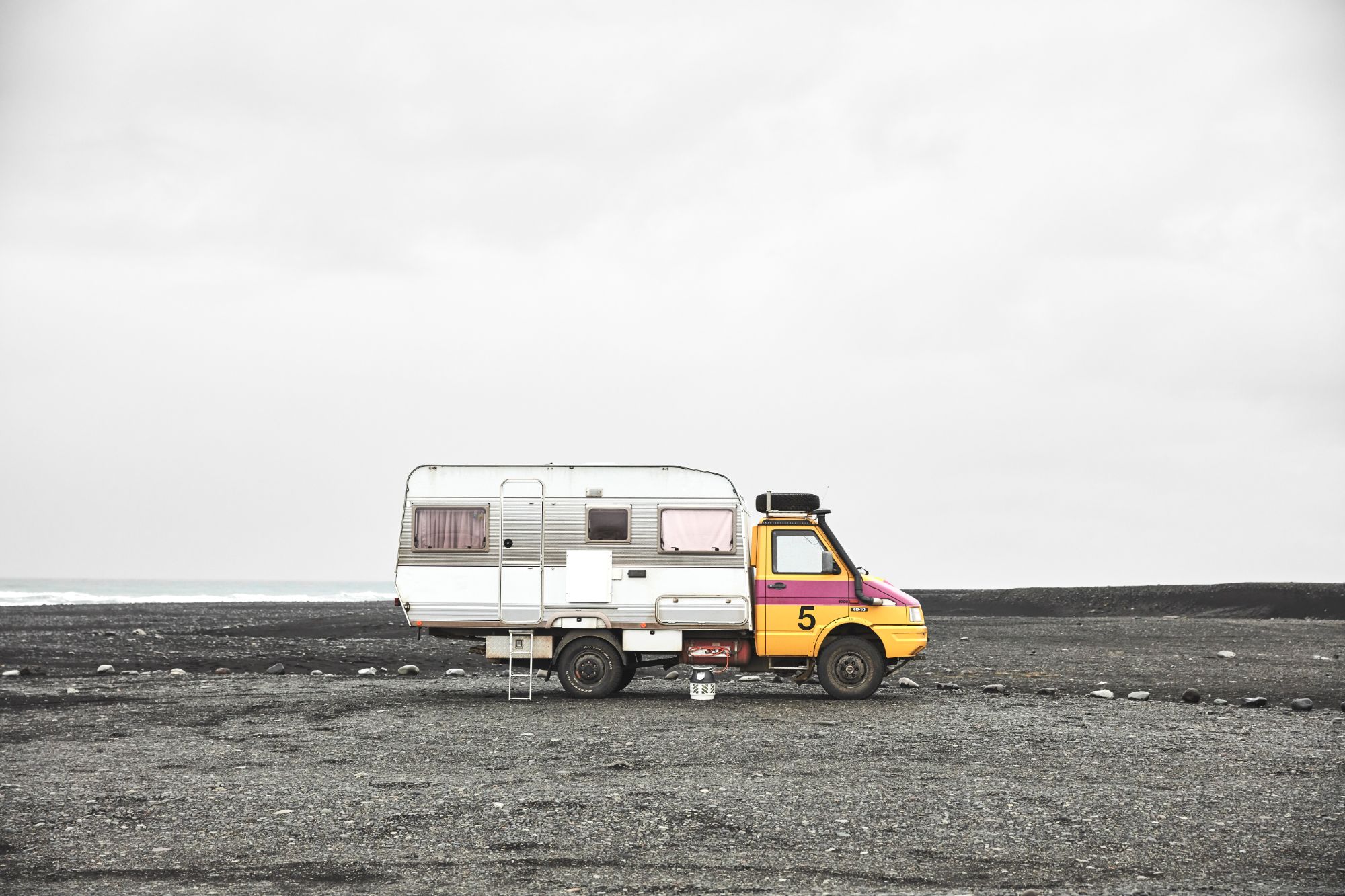 Campervan on Iceland beach.