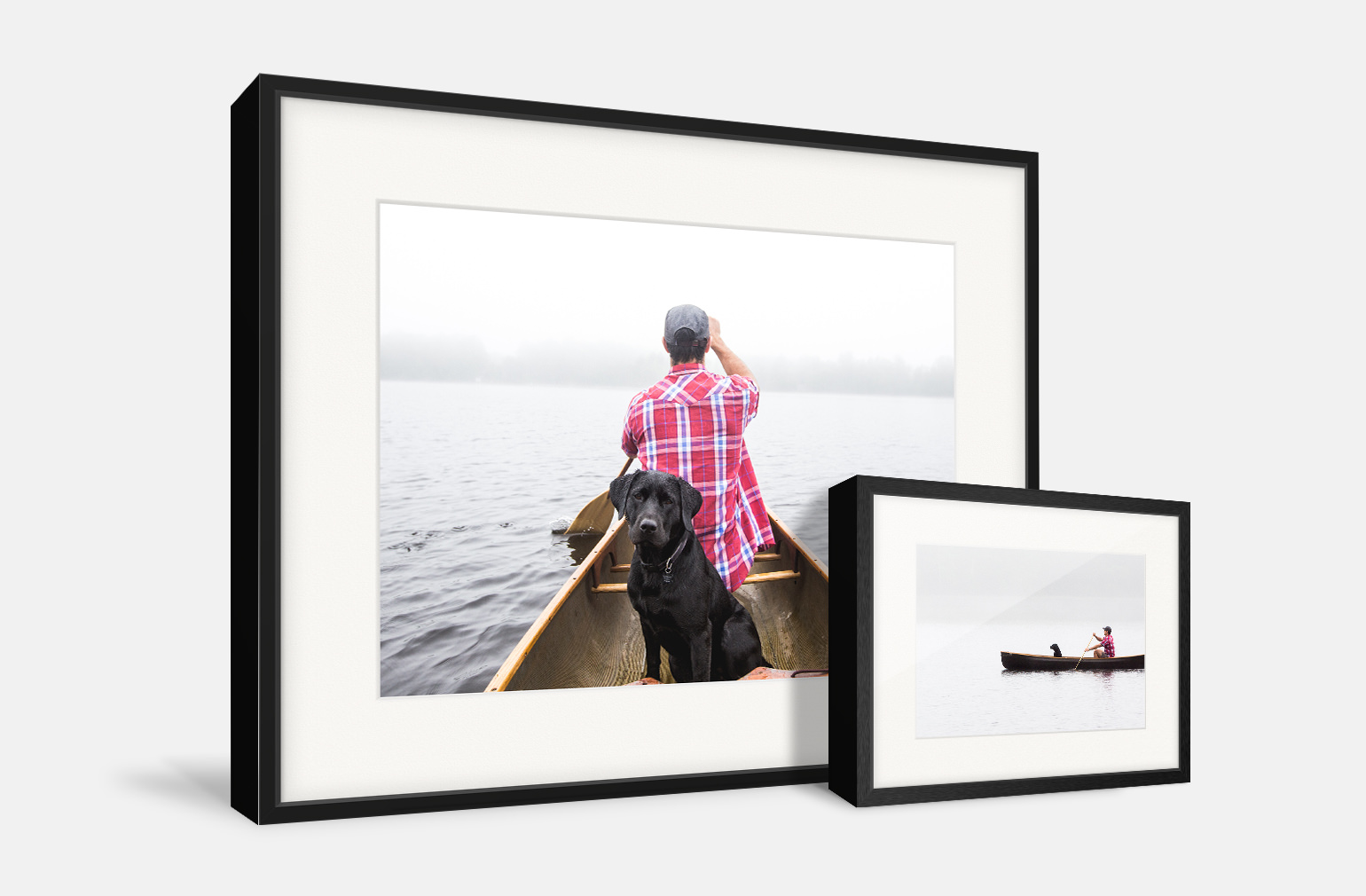 Two gallery frames side by side of a man and his dog on a canoe.