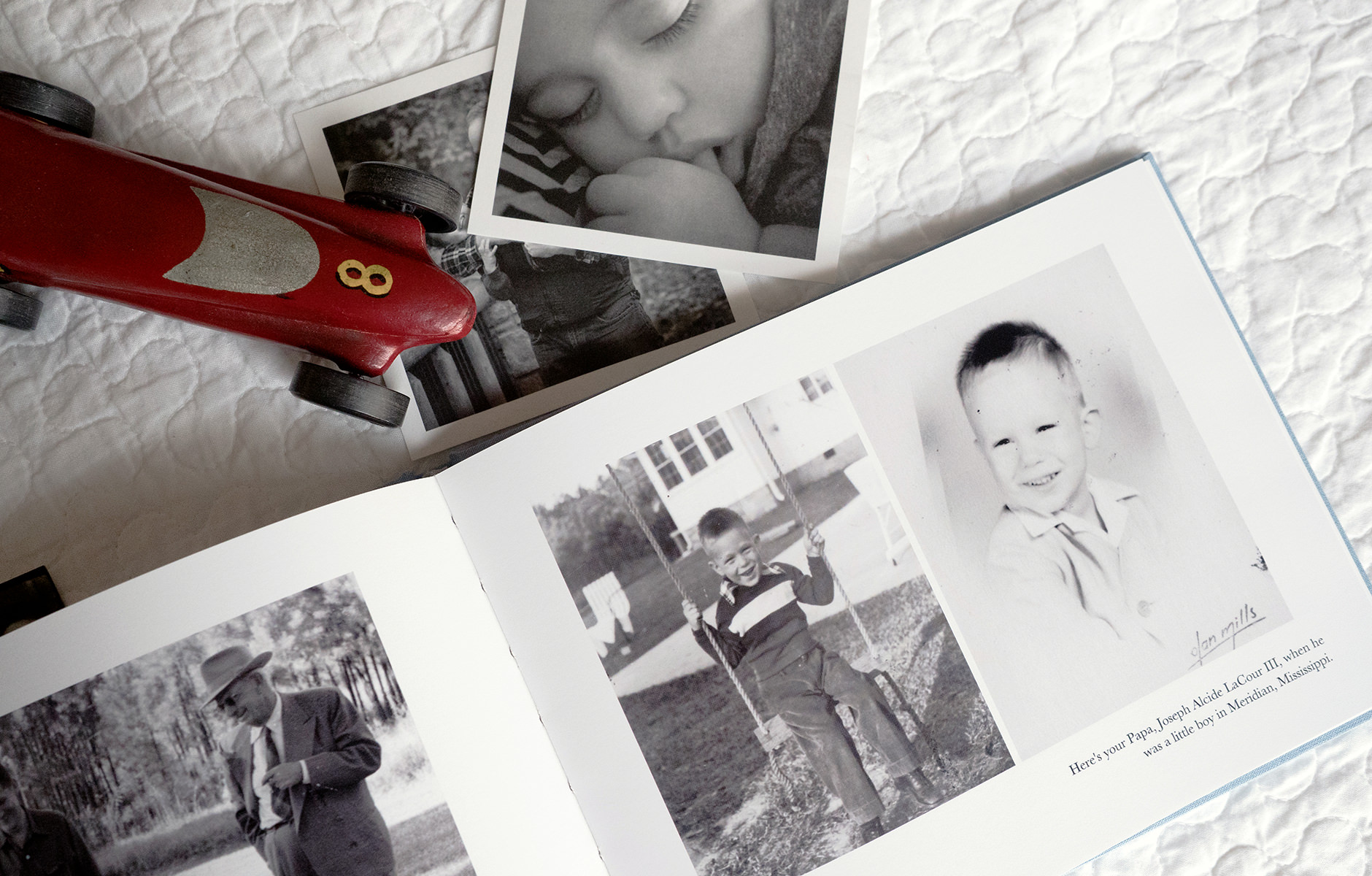 Photo Book with photographs and an old toy car