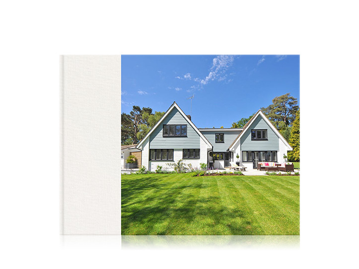 Landscape premium home photo book with a 3/4 cover of a house.