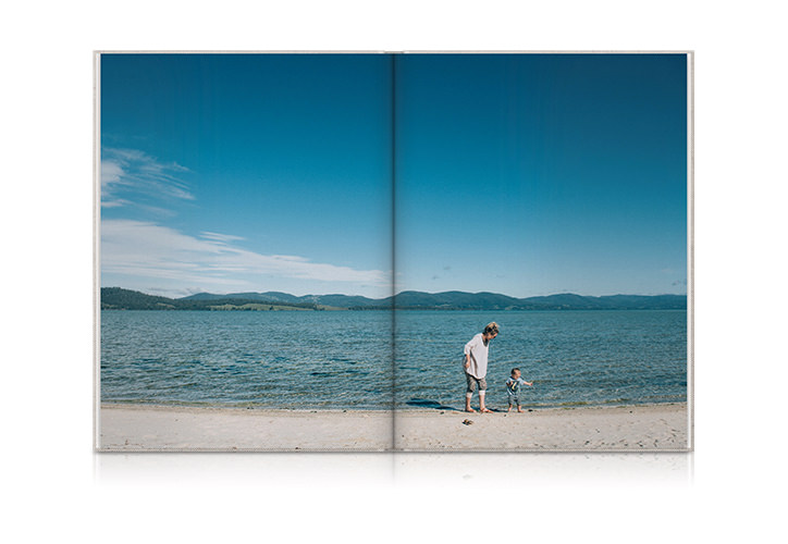 Open Premium Photo Book showing image of family at beach