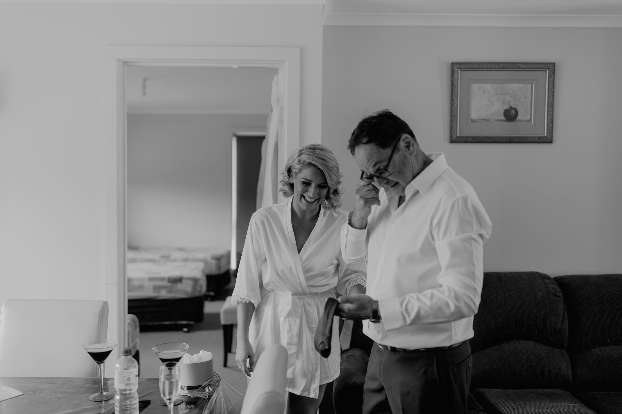 Bride with father getting ready for wedding day