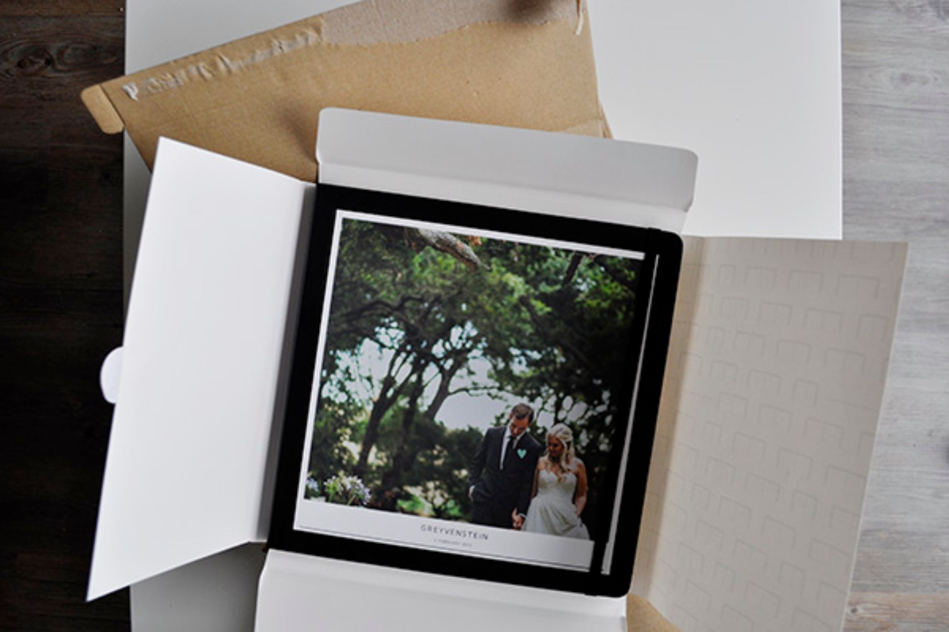 Opening of a package with a Moleskine Photo Book.
