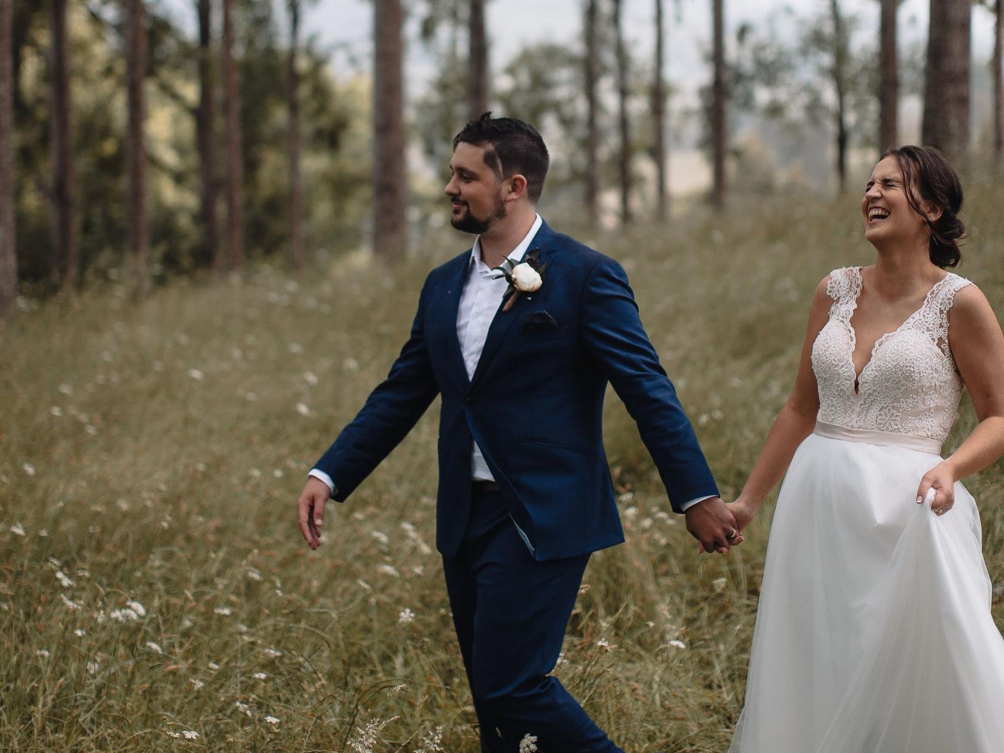Bride laughing with groom