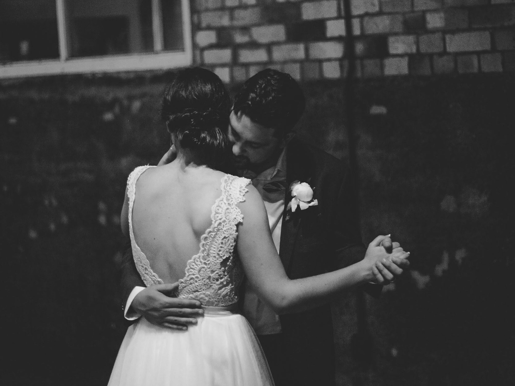 Bride and groom slow dancing together