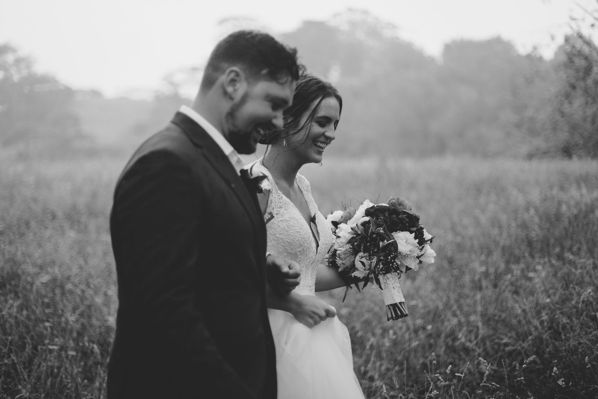 Bride and groom laughing together
