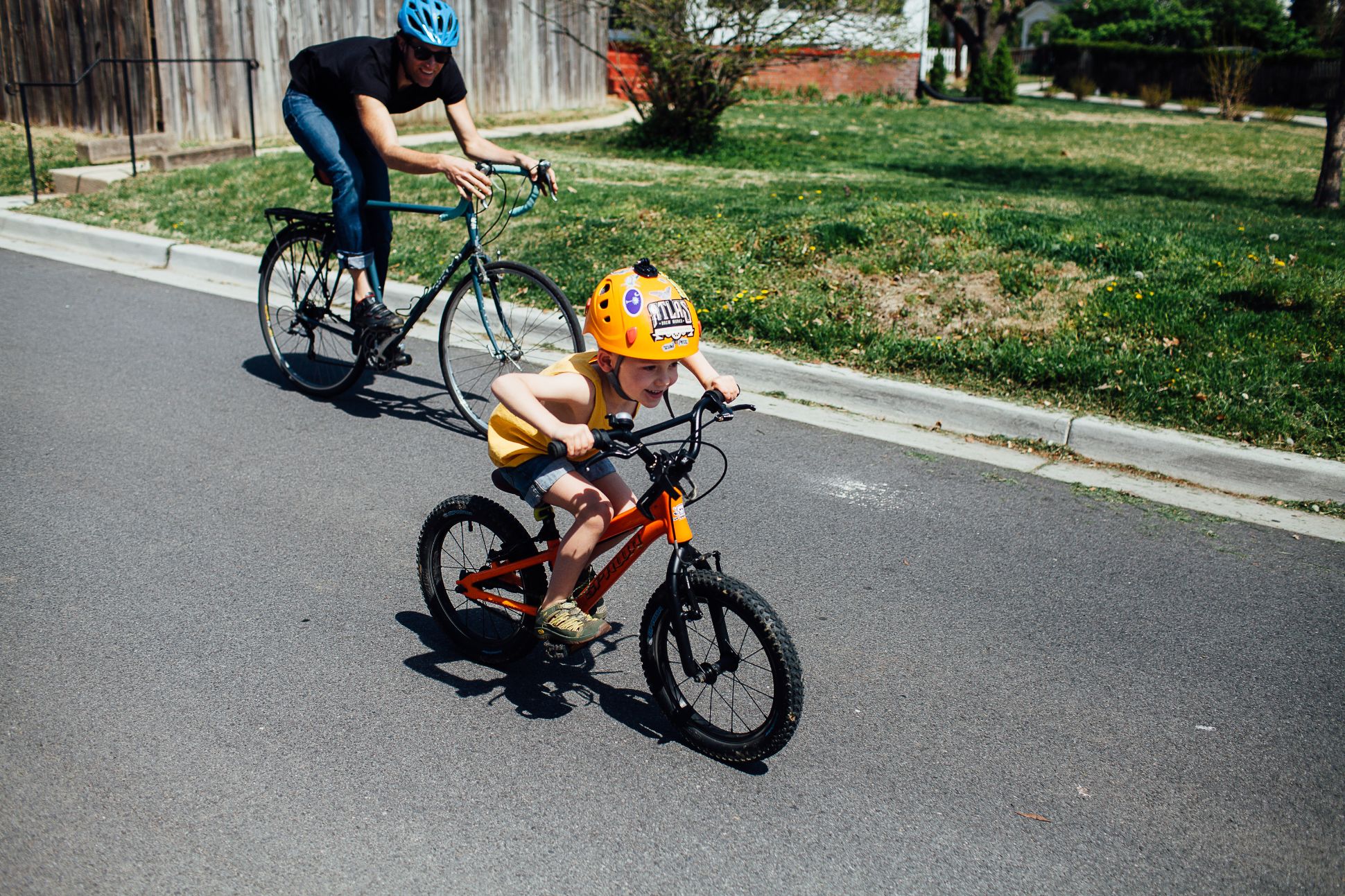 Parent and child riding bikes together