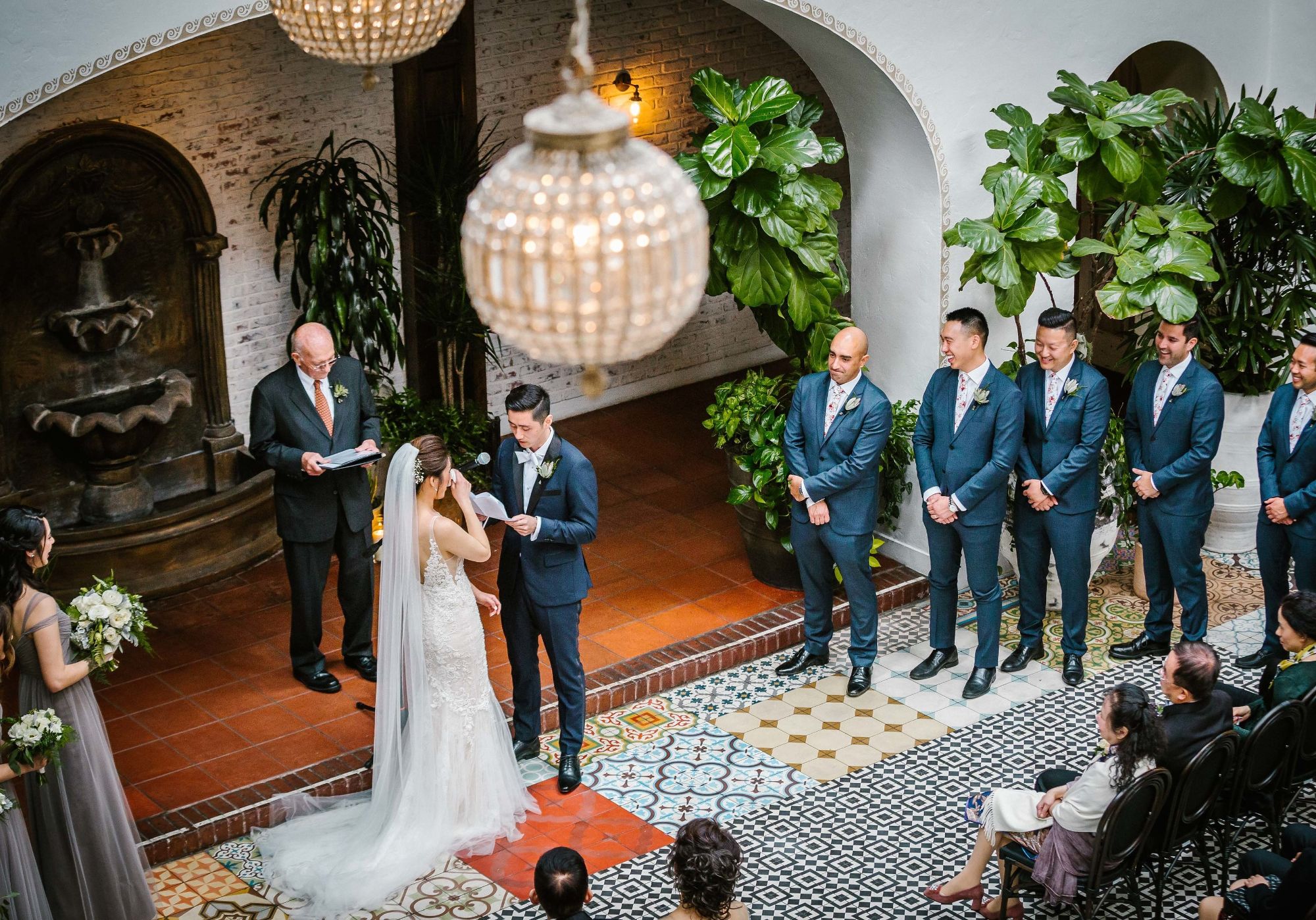 Bride crying as groom shares vows