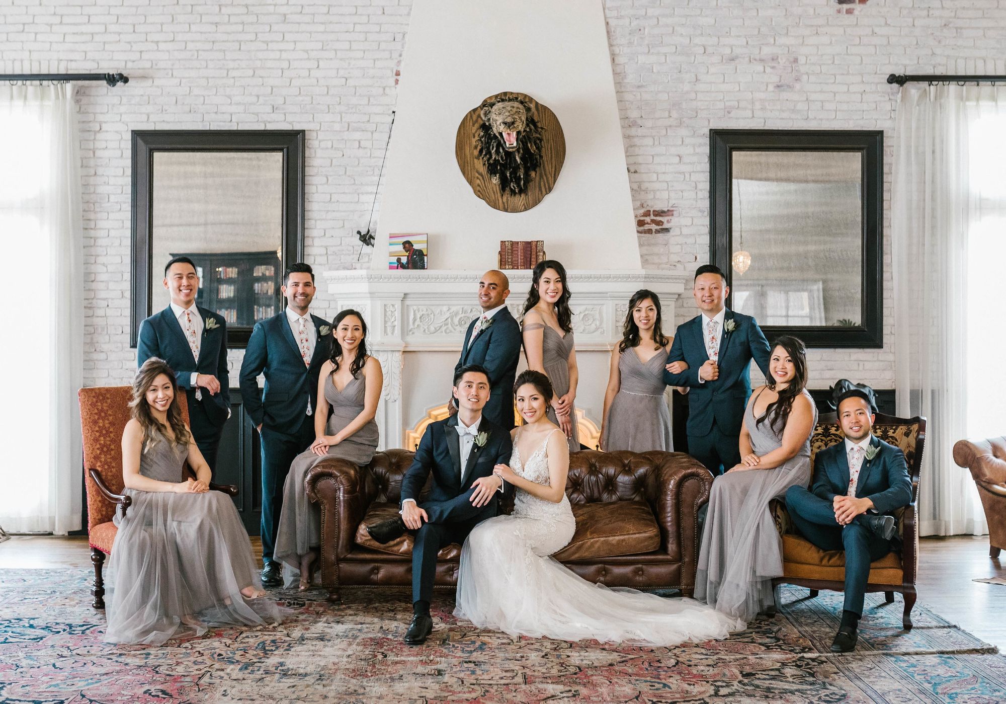 Bride and groom pose with bridal party in cocktail room