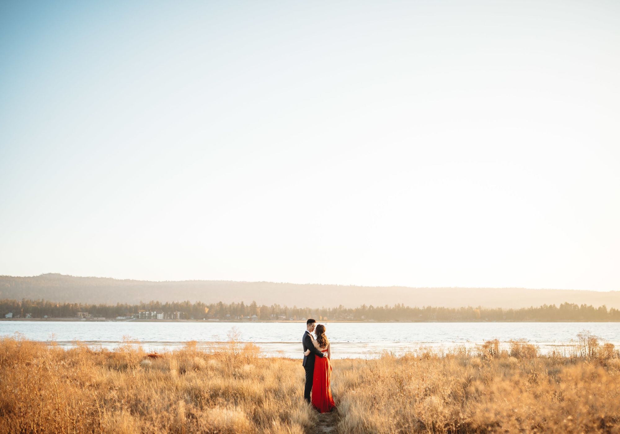 Bride and groom on beach by sea