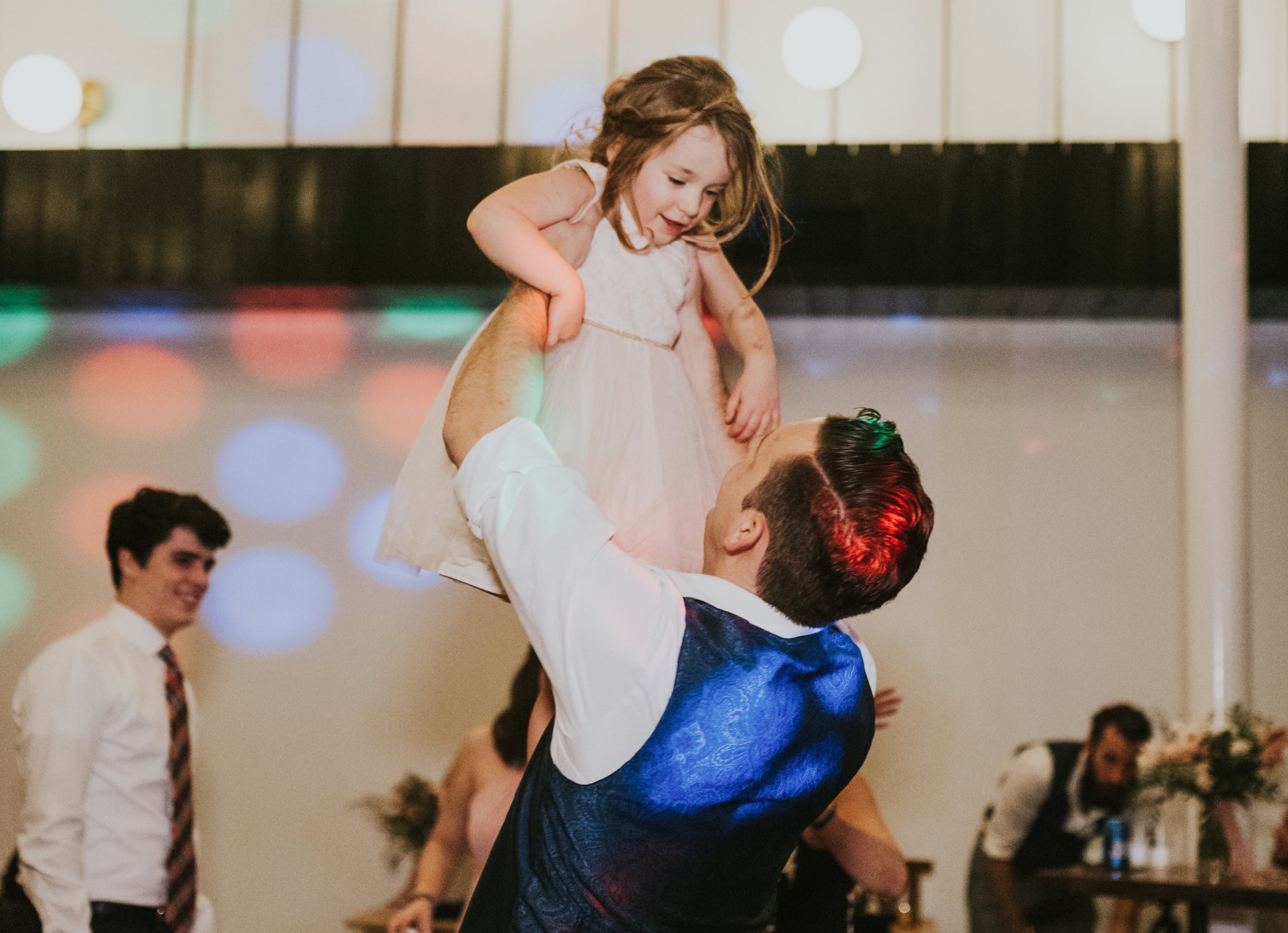 Groom with child on the dancefloor