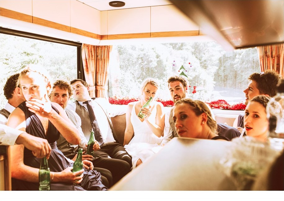 Bride and wedding guests gathered and sharing a drink