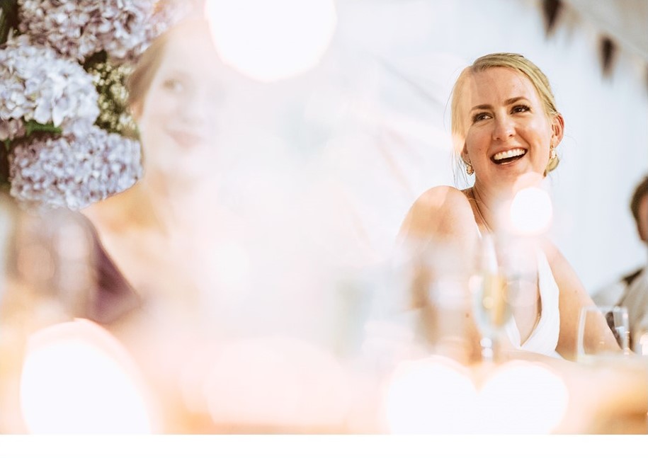 Bride smiling at wedding reception