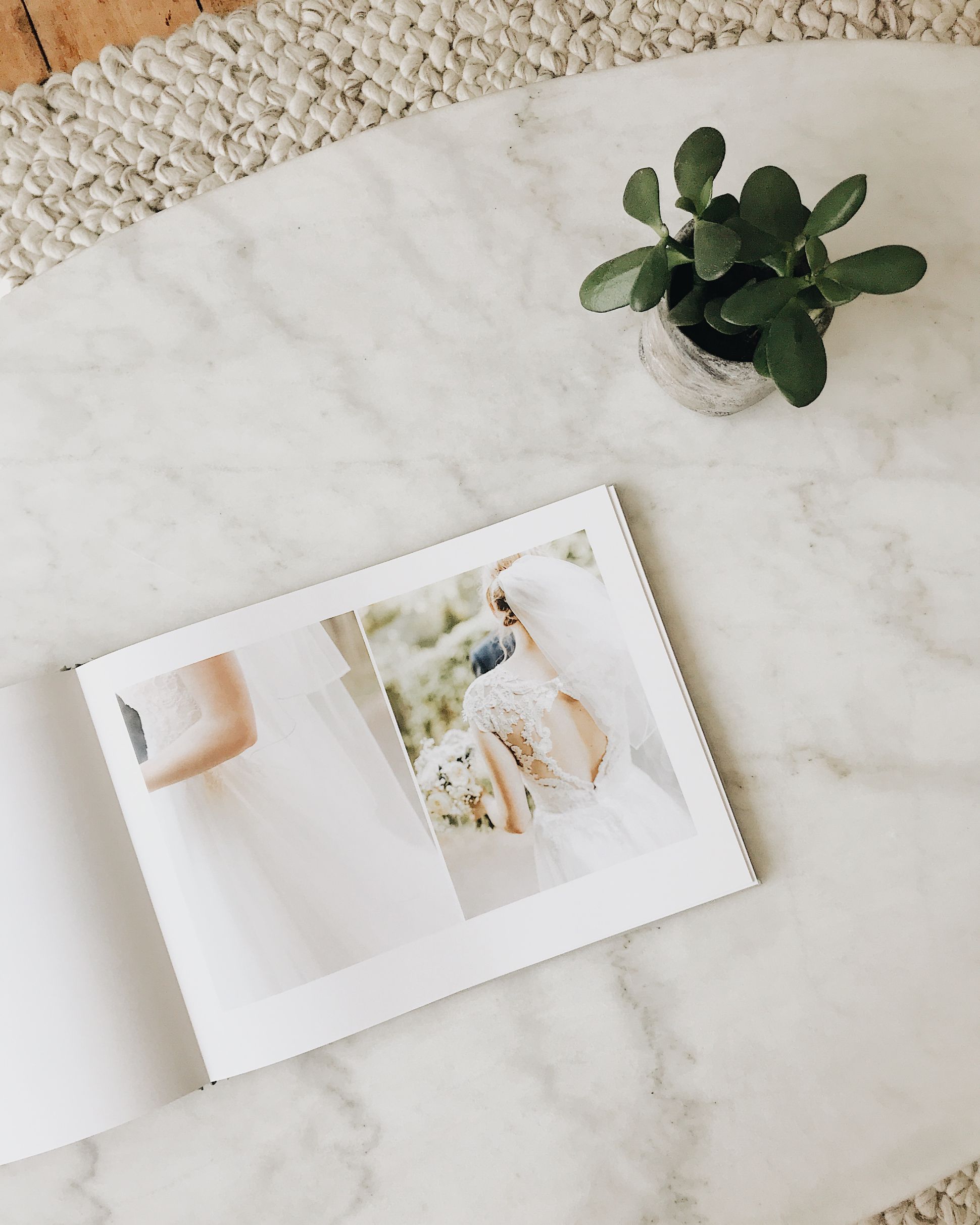 Opening wedding book showing photos of bride