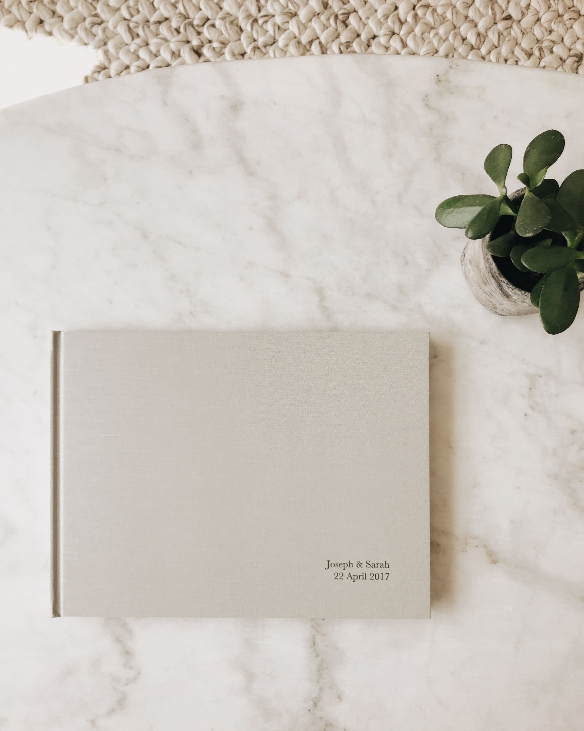 Wedding book atop marble coffee table