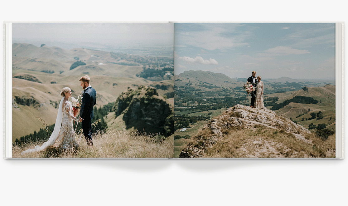 Open Photo Book showing photos of newlywed portraits taken on hillside
