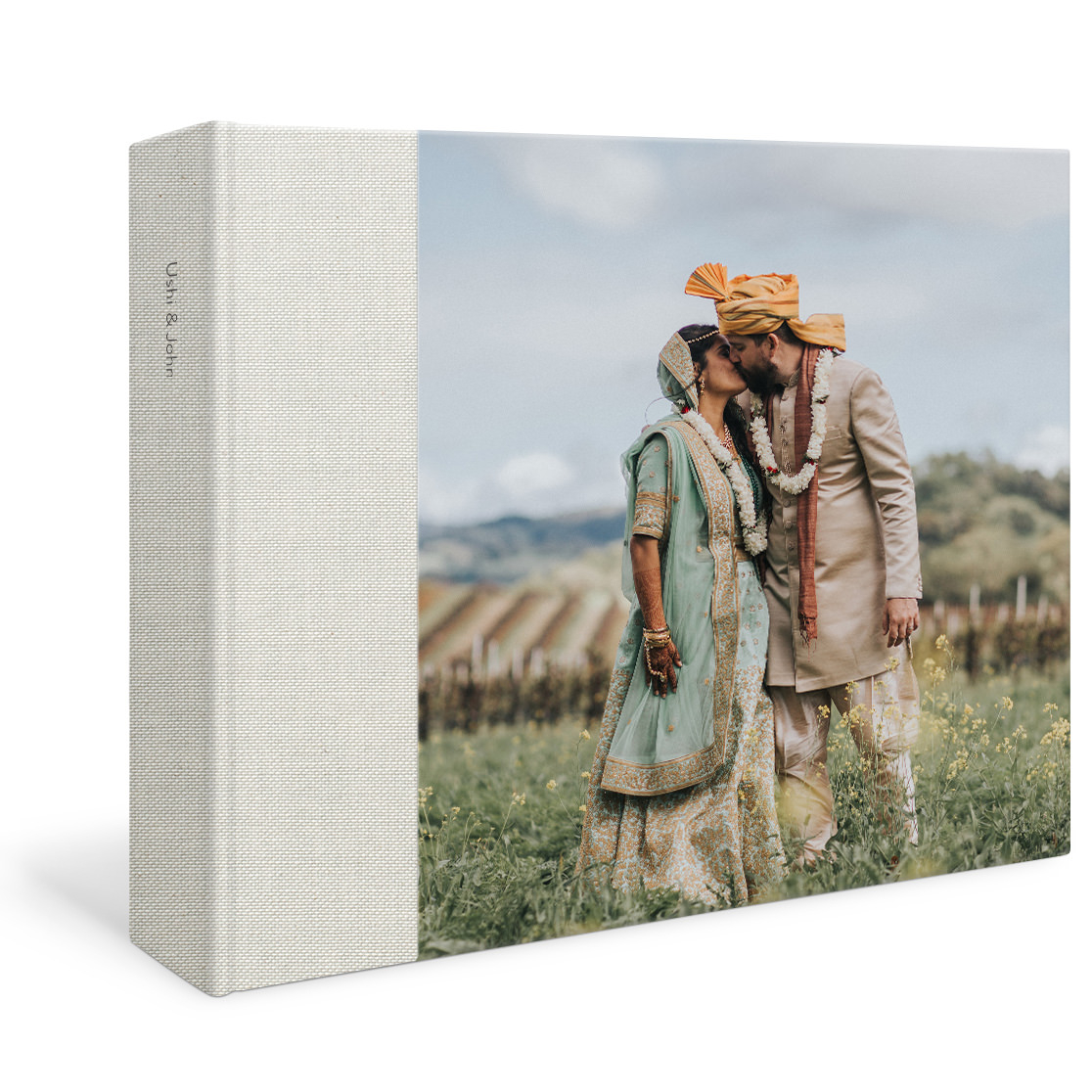 Large premium square photo album with an image of a couple on their wedding day on the cover.