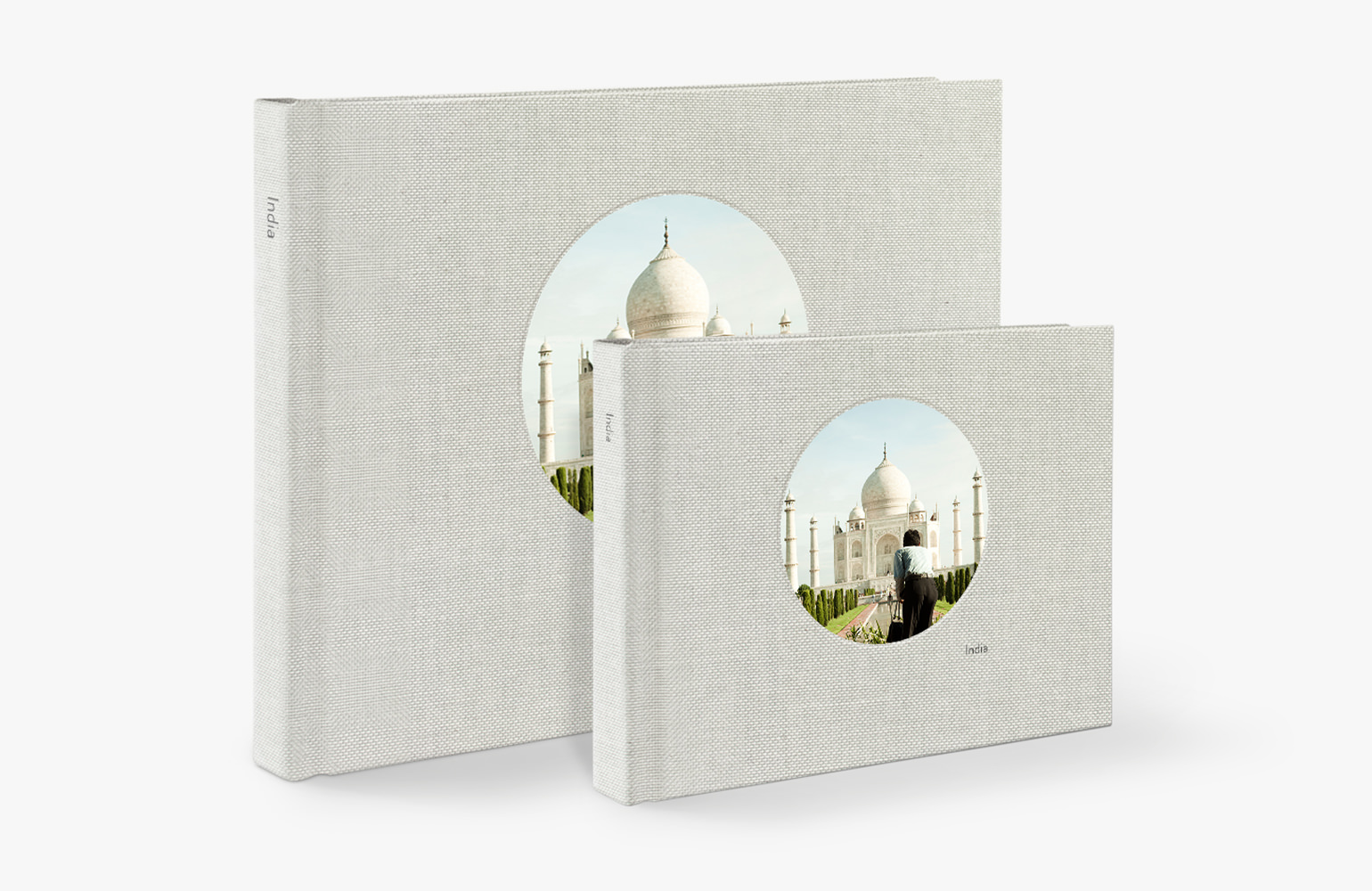 Two standing premium landscape photo books with image of the Taj Mahal on both covers.