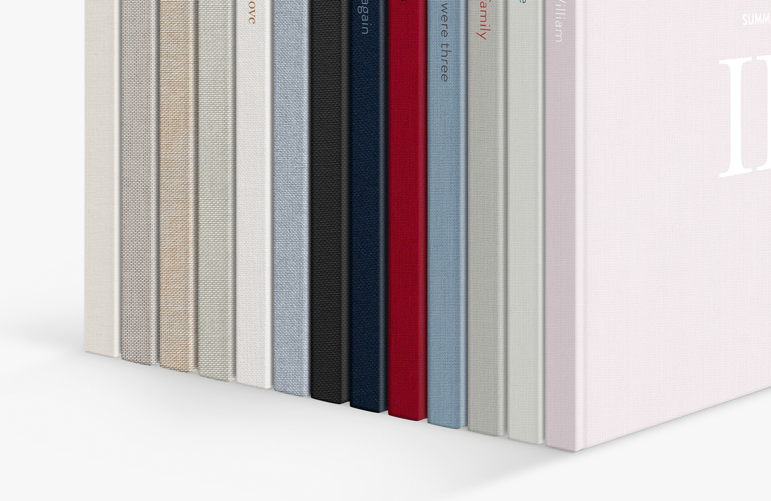 Standing row of photo book showcasing range of MILK fabric colors