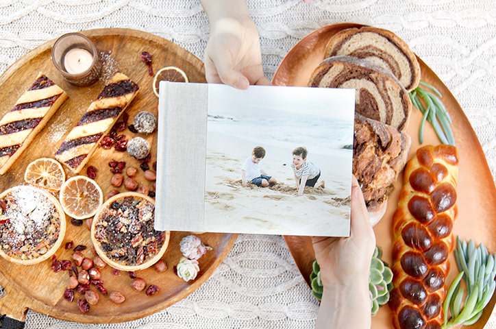 Premium Photo Book with photo of two boys playing on sand on cover