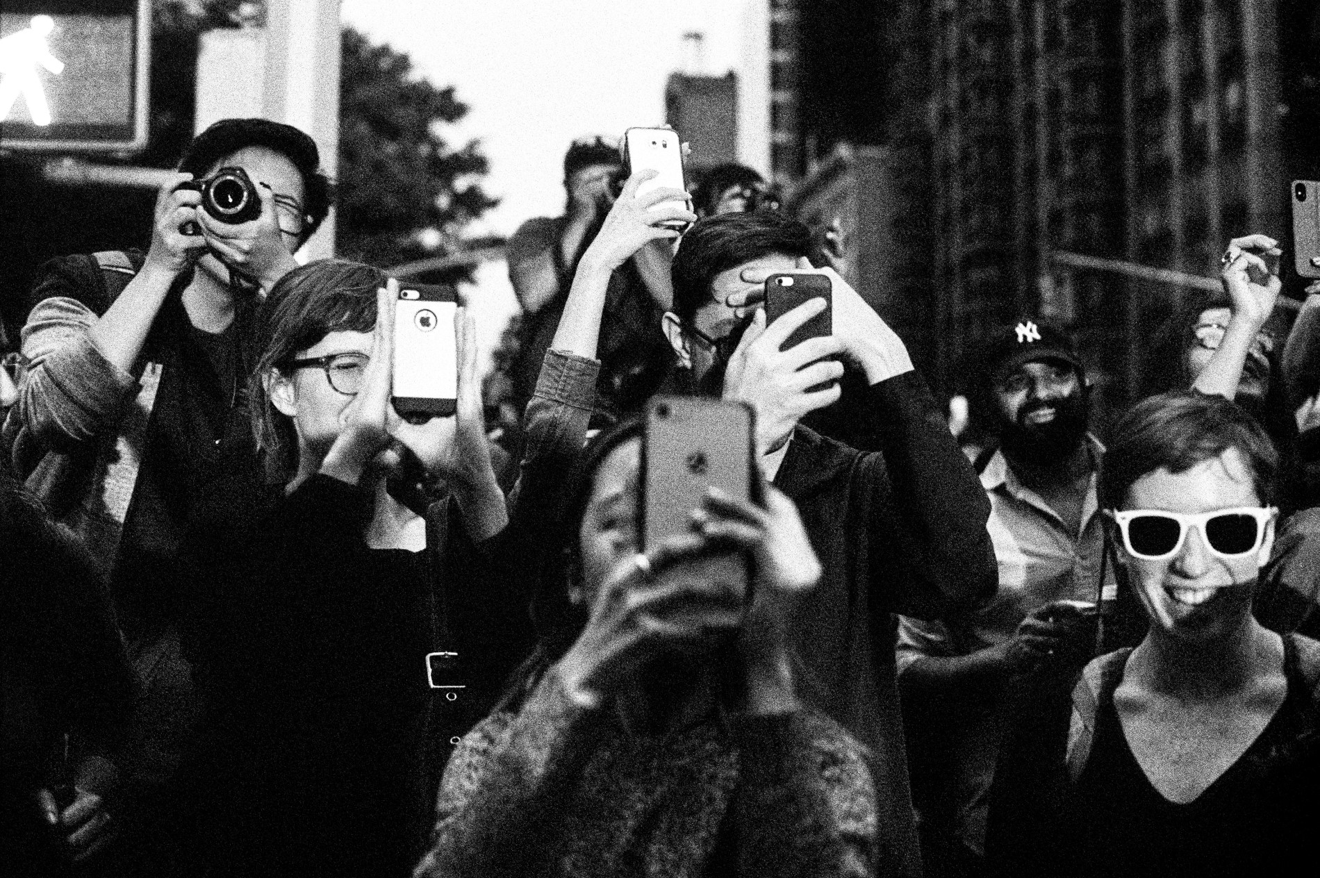 Crowd of people taking photos of Manhattanhenge