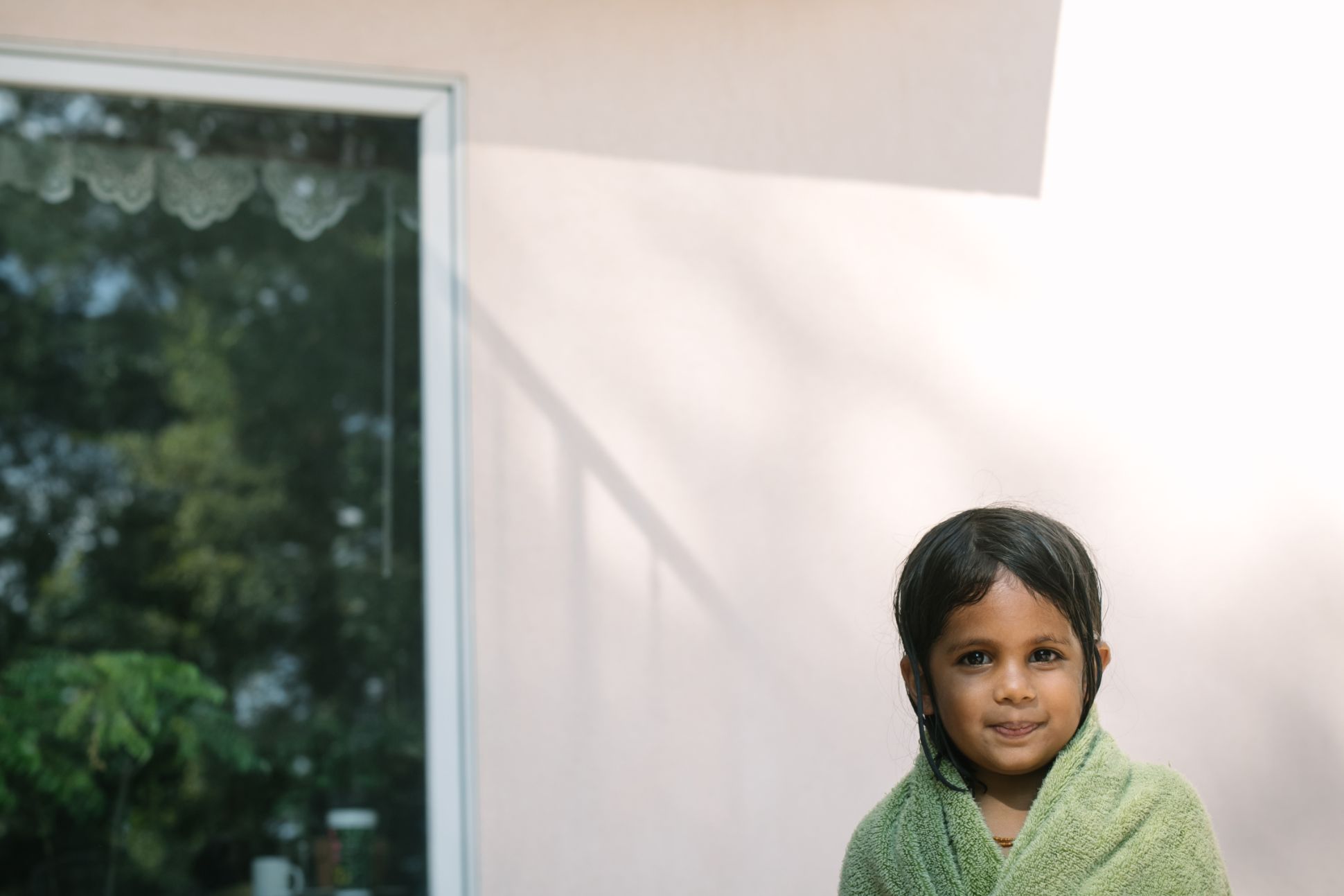Young child wrapped in a towel.