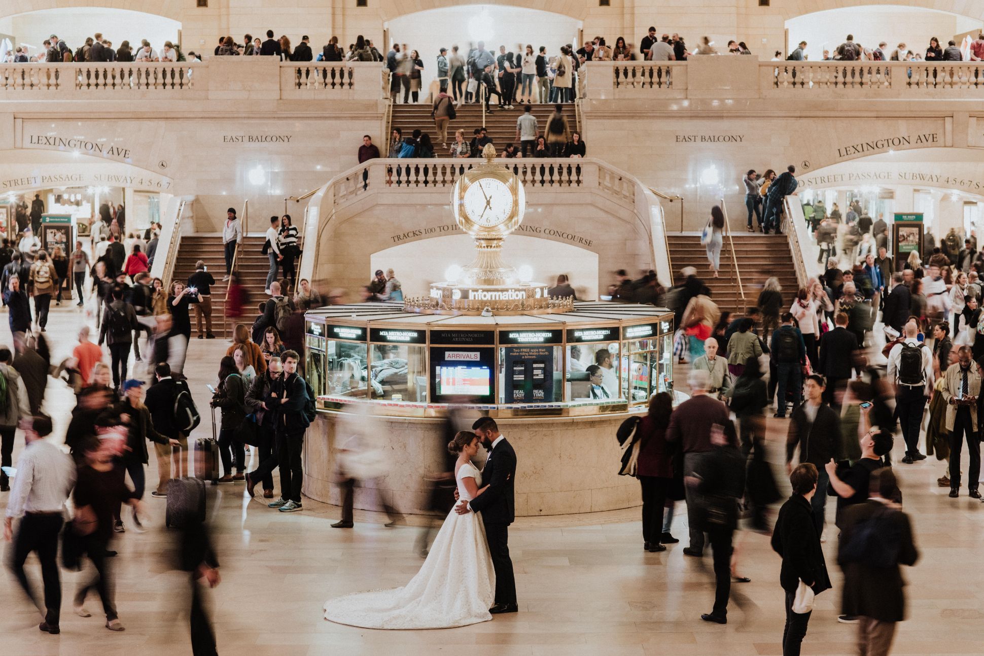 Bride and groom in train station