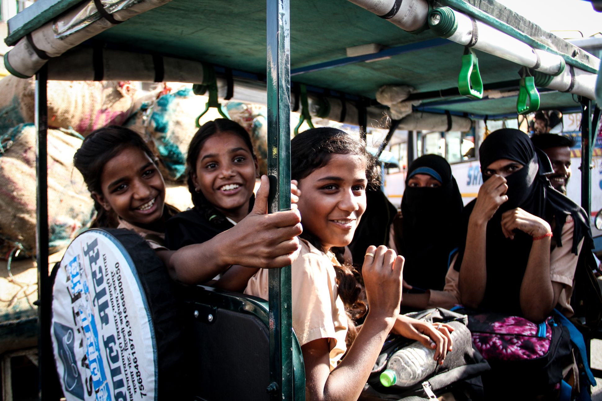 School girls in tuk tuk, India