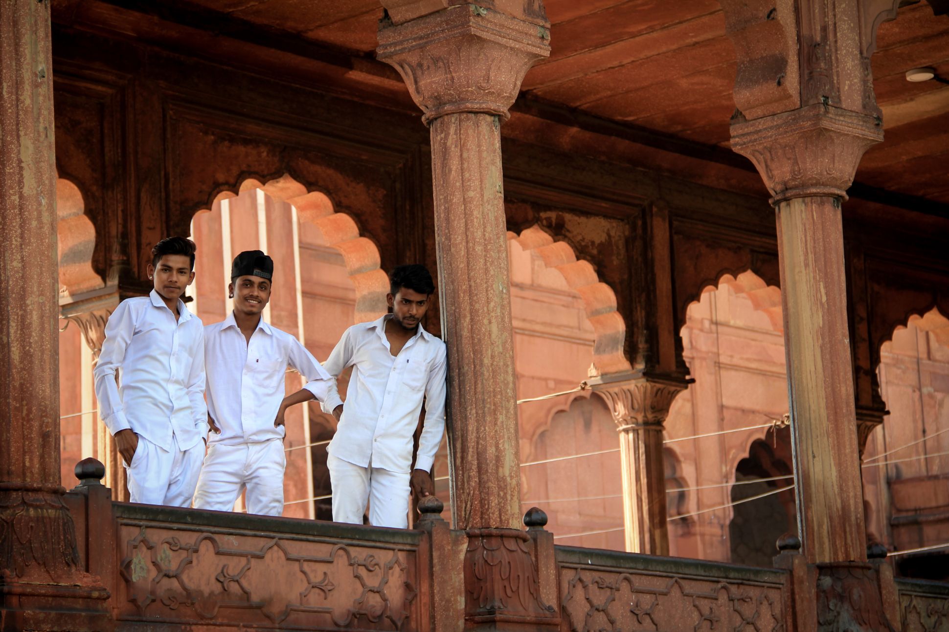 Three friends dressed in all white