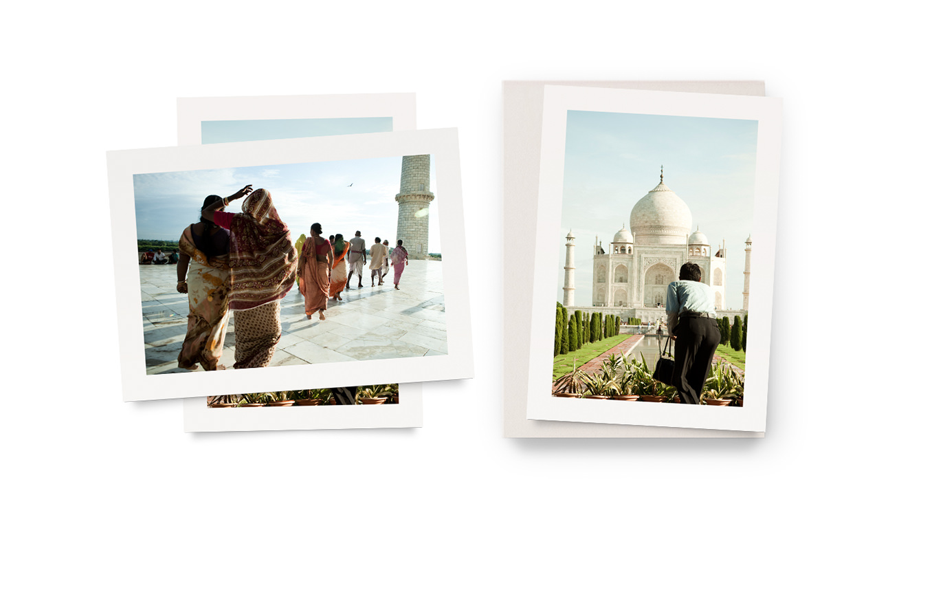 Two travel art prints laying next to their presentation box.