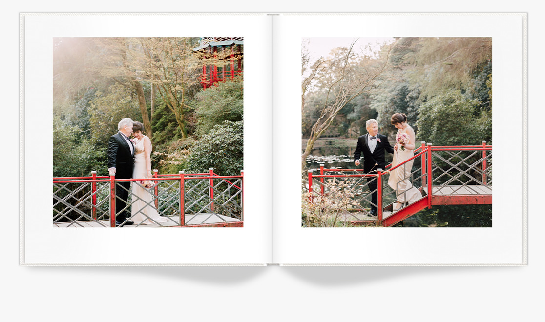 Open Photo Book showing photos of newlyweds posing in Japanese Garden