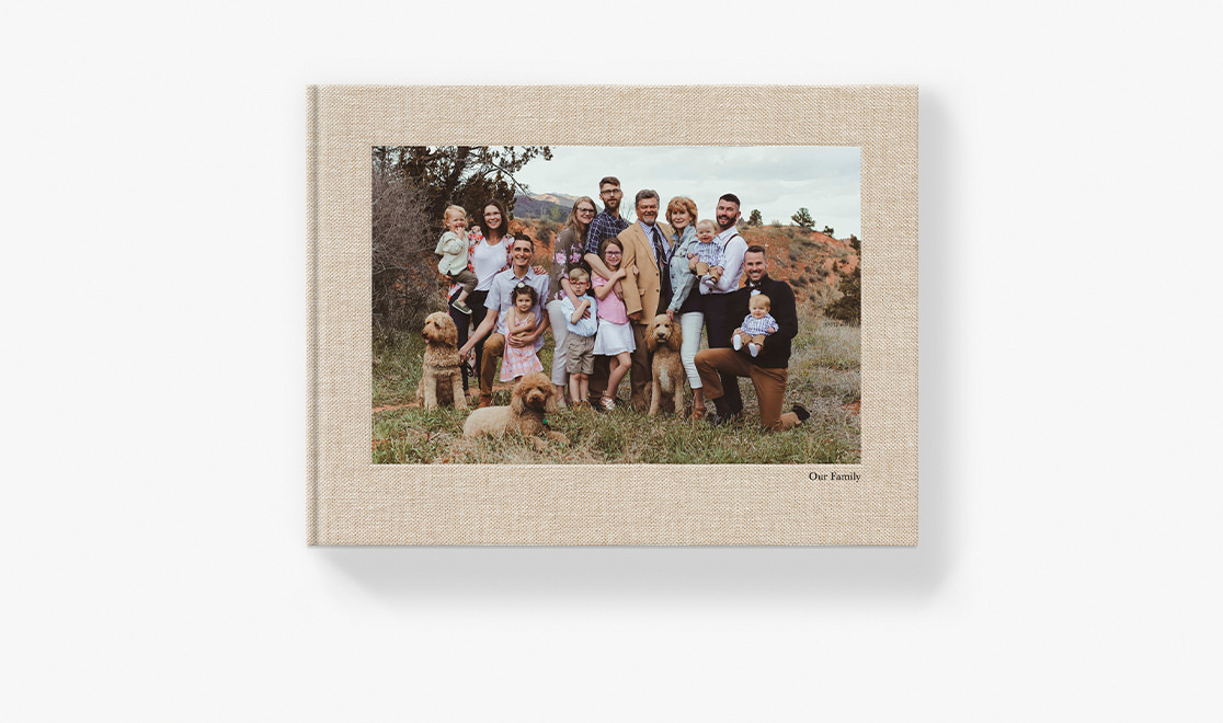 Photo book with large family portrait on the cover.