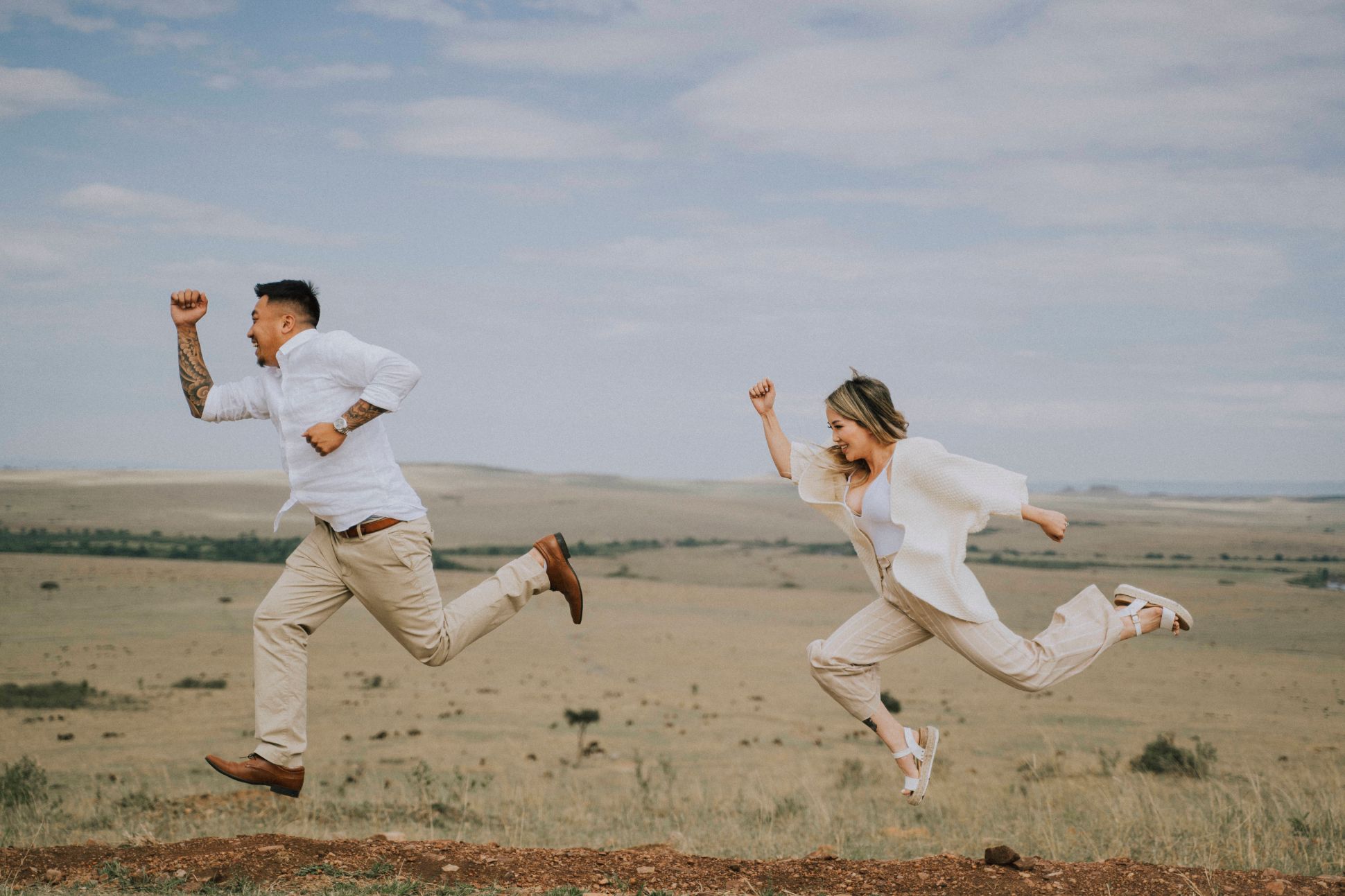 Man and woman pretending to run away from a predator.