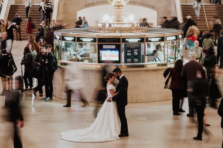 Bride and groom in train station