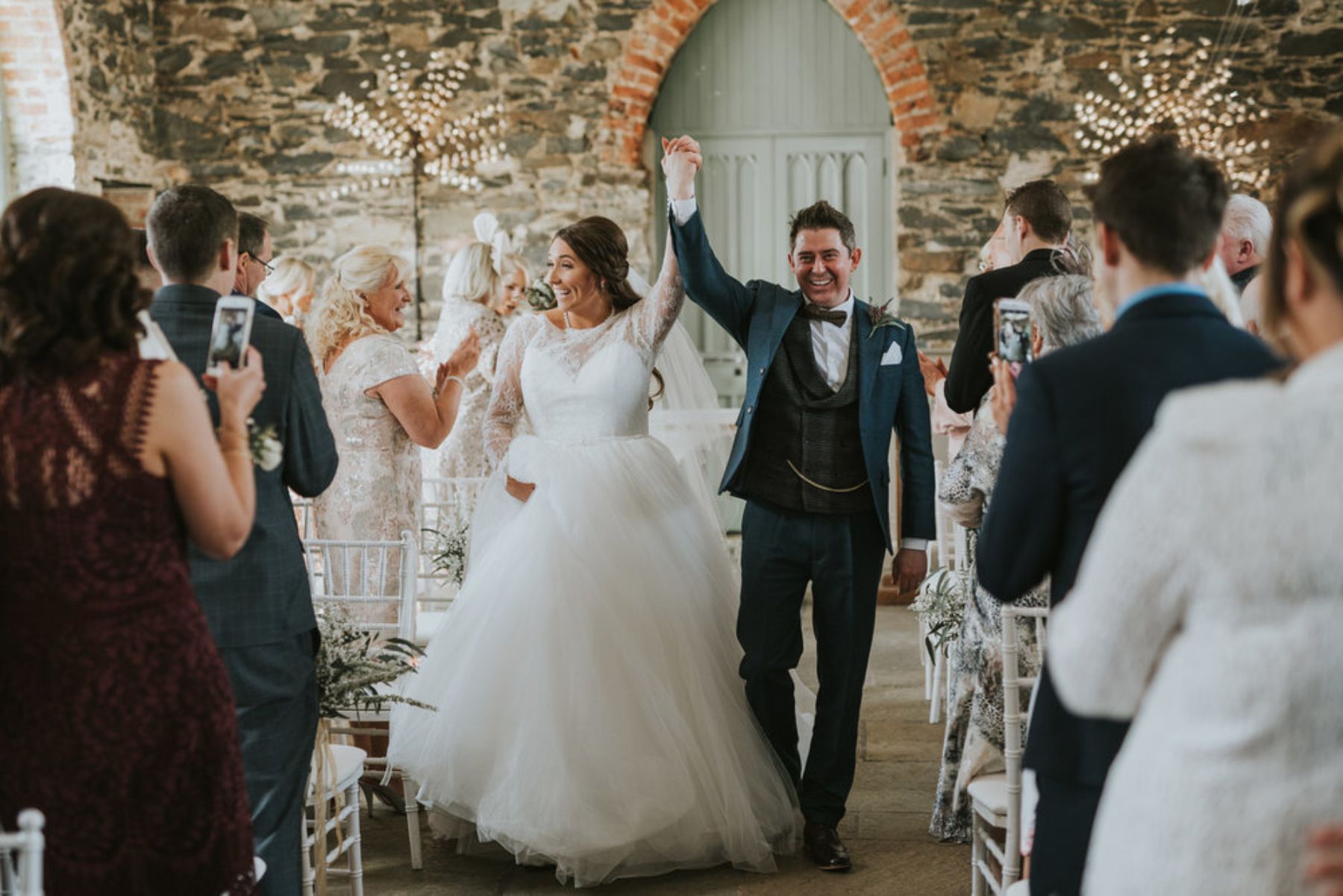 Couple walking down the aisle together