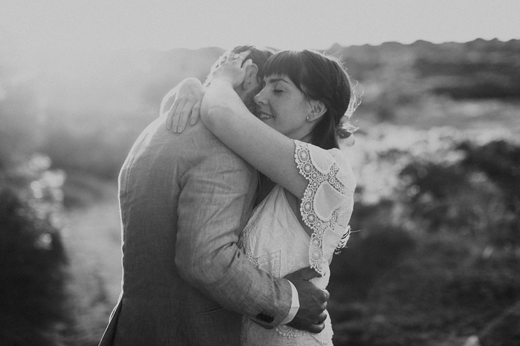 Newlywed couple hugging