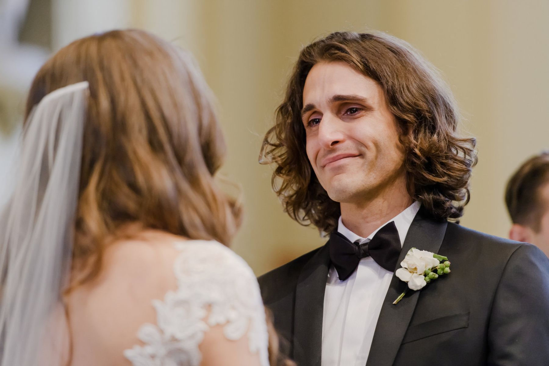 Groom crying at the altar