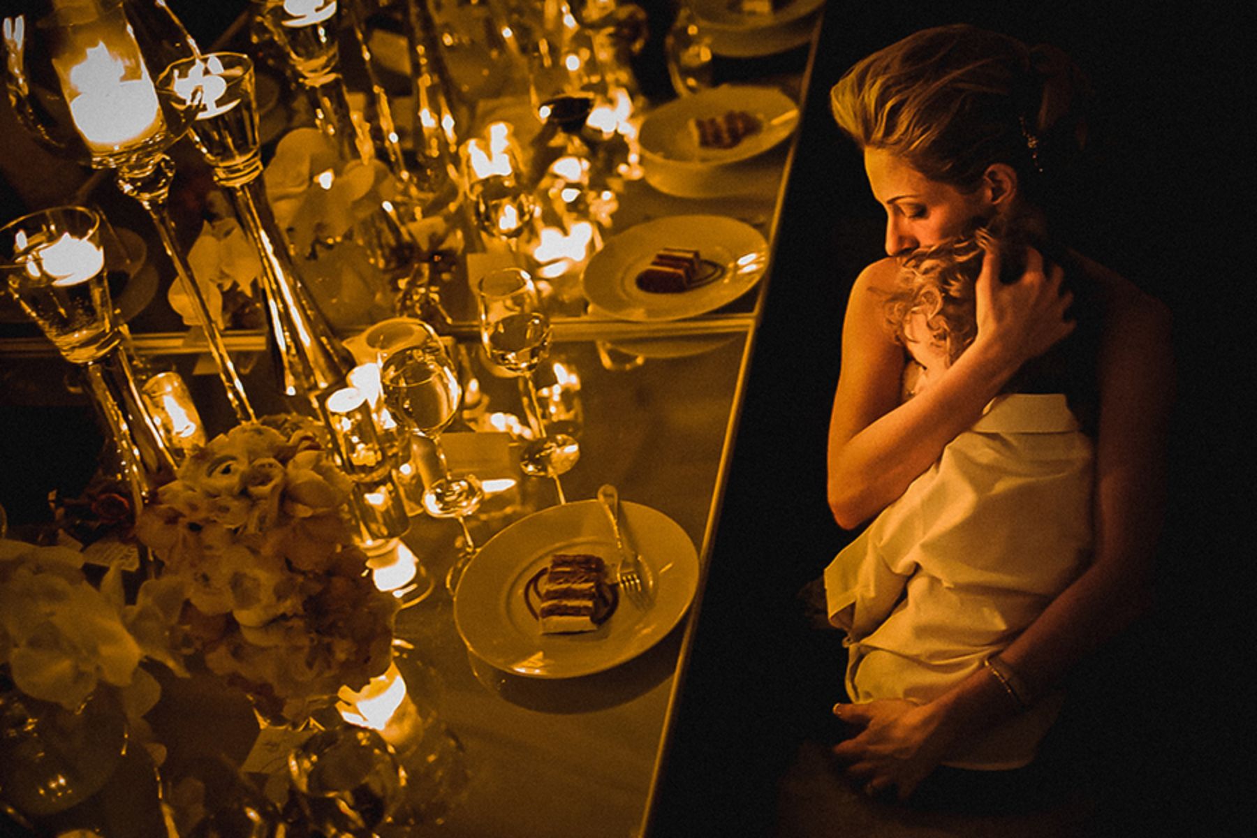 Woman holding child at wedding table