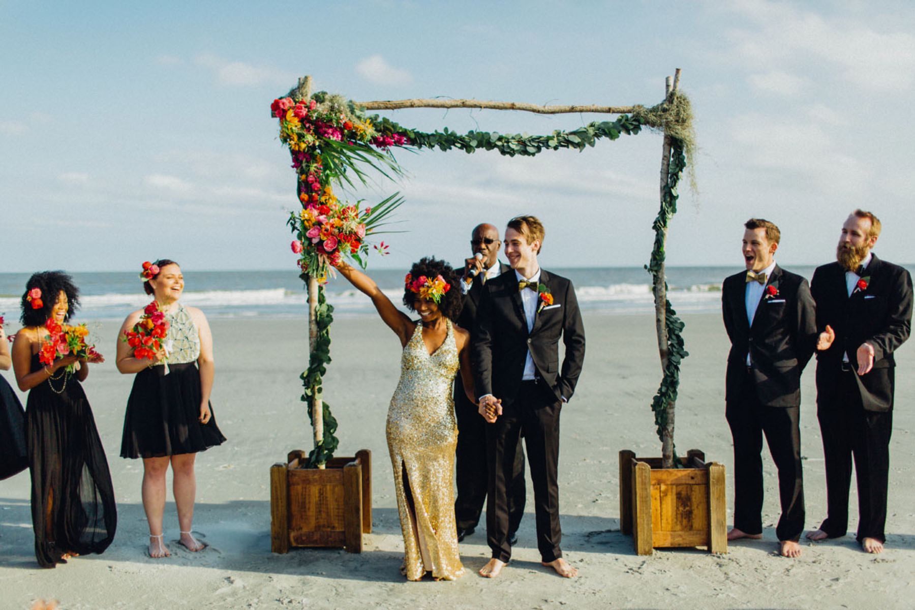 Bride and groom enjoying ceremony on the beach