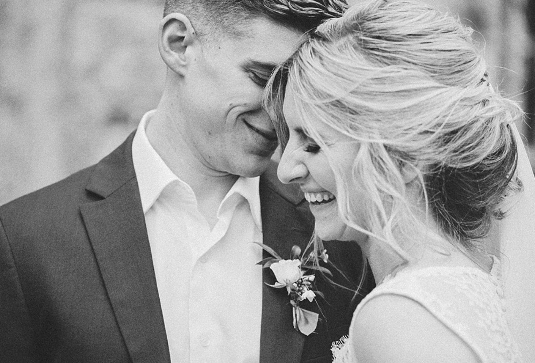 Bride and groom smiling together